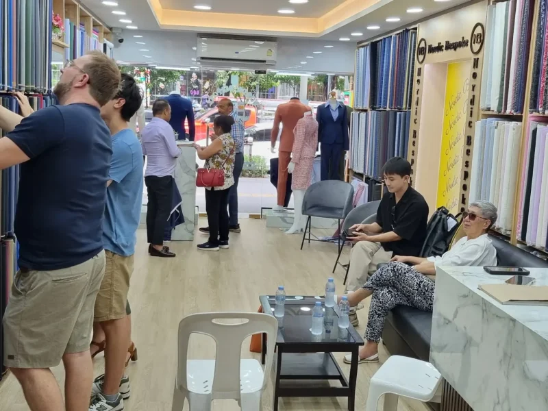 Inside Nordic Bespoke Tailor store showing customers and tailoring consultation area